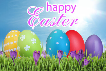 Happy Easter. Bright eggs and spring flowers on green grass outdoors