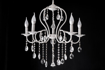 Contemporary glass white chandelier isolated on black background