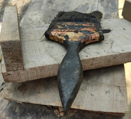 Colouring brush on a wooden background