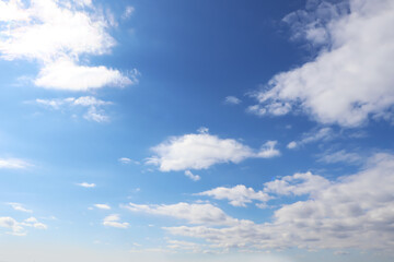 Naklejka na ściany i meble View of beautiful blue sky with white clouds