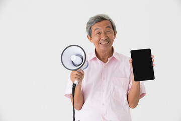 Kindly face good looking senior old Asian man with gray hair holding bullhorn and tablet computer and smile with happy on white background.