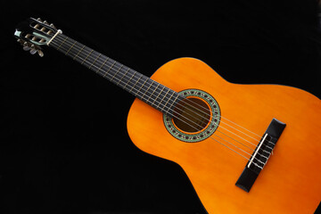 Naklejka na ściany i meble The guitar is a musical instrument that is used in a wide variety of musical styles. It typically has the six strings, but four, seven, eight, ten, and twelve string guitars also exist.