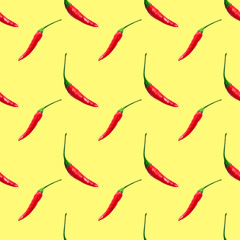 Small hot red chili peppers isolated on yellow background. Seamless pattern