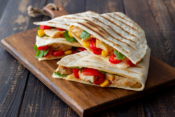 Quesadilla with chicken, tomatoes, corn, cheese and chilli. Mexican food. Fast food.