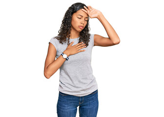 Fototapeta premium Young african american girl wearing casual clothes touching forehead for illness and fever, flu and cold, virus sick