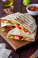 Quesadilla with chicken, tomatoes, corn, cheese and chilli. Mexican food. Fast food.