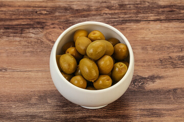 Green pickled olives in the bowl
