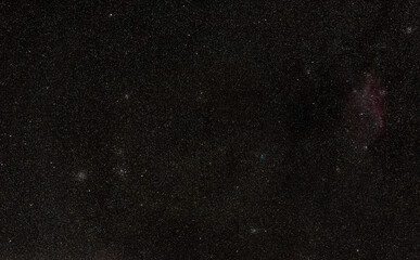 Winter night sky with many stars, Seagull nebula visible in upper right corner,  M47 and M46 open clusters left side
