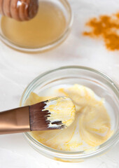 Homemade face mask from turmeric, yoghurt, and honey. Beauty, homemade skin care concept