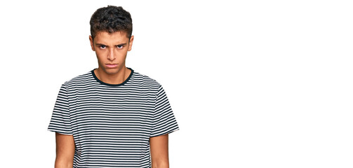 Young handsome african american man wearing casual clothes skeptic and nervous, frowning upset...