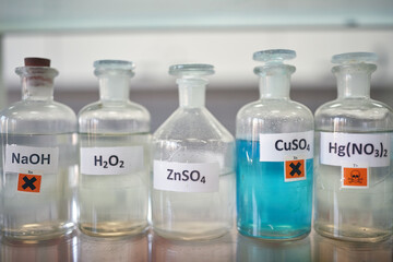 Dangerous chemicals on the shelf in the laboratory. Chemistry, lab, chemicals