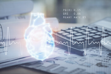 Double exposure of heart drawing and desk with open notebook background. Concept of medical education