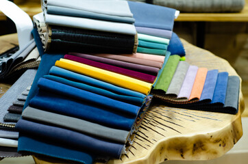 Colorful upholstery fabric samples in the store. Types Of Fabrics.