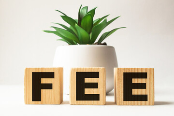 a word FEE on wooden cubes. business concept. business and Finance