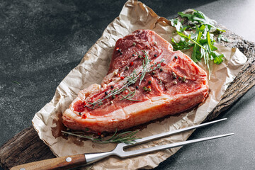 Raw fresh meat t-bone steak with spices