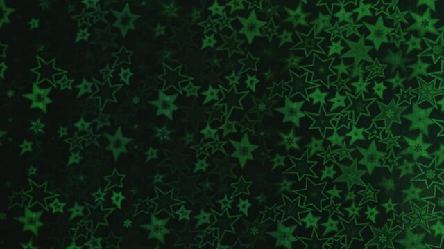 Green stars shimmer in different shades, starry bokeh, background