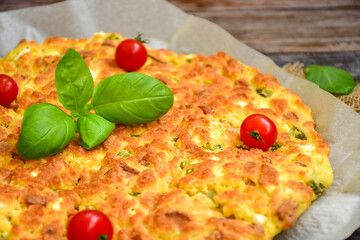  Homemade  italian  frittata  omelette  cheese pie  with potatoes and organic bio eggs,ham,cheese and   cherry tomatoes and fresh  ruccola. 
