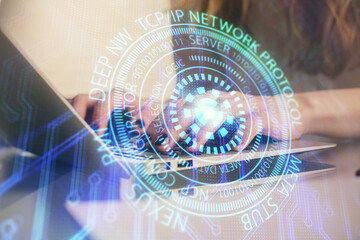 Double exposure of woman hands working on computer and data theme hologram drawing. Tech concept.