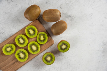 Many of kiwi fresh fruits on a wooden board
