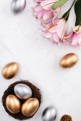 Fototapeta na wymiar Golden and silver Easter eggs in the nest with pink Double Lily flower.