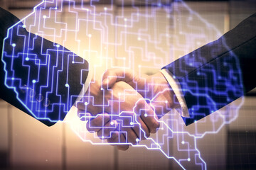 Double exposure of brain hologram and handshake of two men. Partnership in IT industry concept.