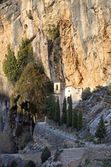 Fototapeta premium Vertical photo of the picturesque Ermita del llovedor in Castellote, Maestrazgo, Teruel, Aragon, Spain