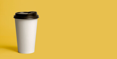 Take away concept. orange takeaway cup .coffee on yellow background, coffee takeaway