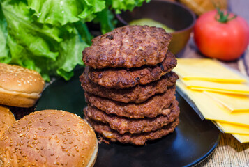 fried beef patty and ready-made burger ingredients