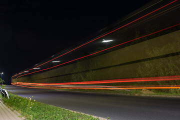 Truck light trails on highway. Art image . Long exposure photo taken on a highway