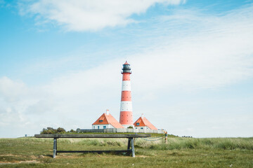 Fototapeta na wymiar Westerheversand and lighthouse in Westerhever in North Frisia in the state Schleswig-Holstein