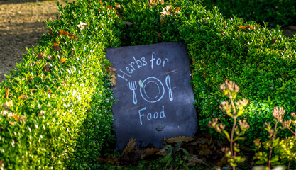 herb for food sign written on the slate roof tile