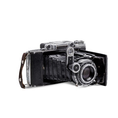 Retro film camera isolated on white background. 