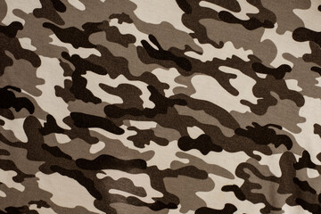 Close-up image of a protective military spotted uniform on the fabric