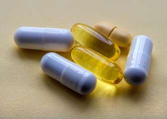 White and yellow medical pills and capsules.