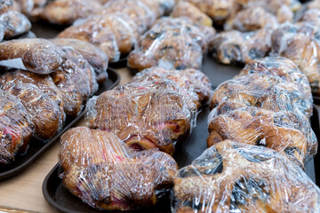 buns in plastic wrap, sold in a hypermarket. selective focus