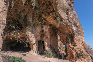 Fototapeta na wymiar View of the Big Cave high above the narrow canyon of Nahal [stream] dry bed, east of Upper Galilee, Northern Israel, south of Lebanon border, Israel.