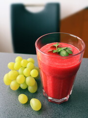 Fresh Smoothie with grapes on a table