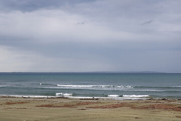 View of Mediterranean Sea with a cloudy blue sky after the rain. Waves and wind in Larnaca beach