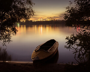 Boat on the beautiful evening Dnieper river