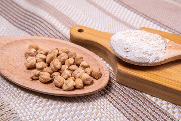 Chickpea flour on a rustic background close-up. selective focus
