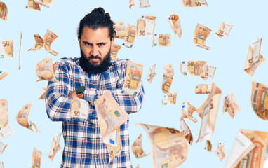 Young arab man wearing casual clothes skeptic and nervous, disapproving expression on face with...