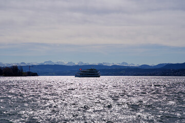 Lake Zurich at a windy day with ship in the center, Switzerland.