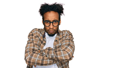 Young african american man with beard wearing casual clothes and glasses skeptic and nervous, disapproving expression on face with crossed arms. negative person.