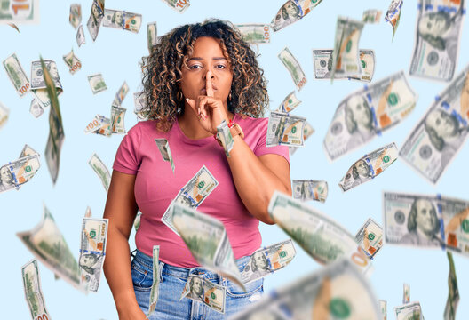 Young african american plus size woman wearing casual clothes asking to be quiet with finger on lips. silence and secret concept.