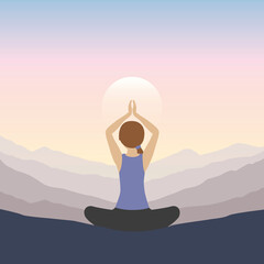 girl makes yoga on mountain landscape at sunset