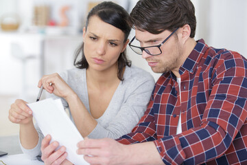 a couple taking care of financial bills