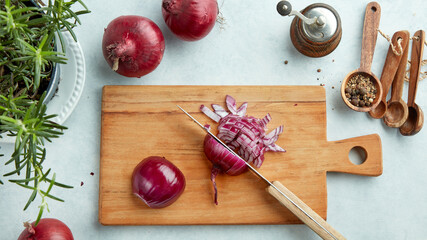chopped red onions on wooden cutting board