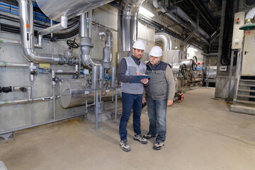 Fototapeta premium portrait of a factory engineers talking