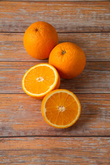 Oranges sliced and served on the wooden table