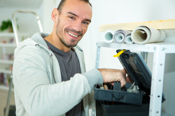 a happy repairman with toolbox